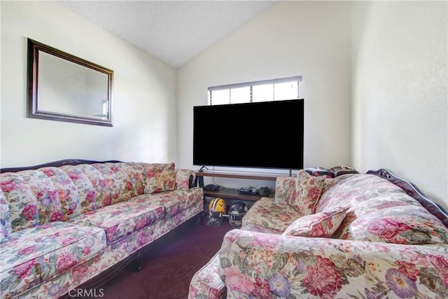 living room featuring carpet floors and vaulted ceiling