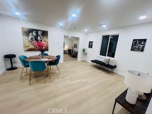 dining room with light hardwood / wood-style flooring