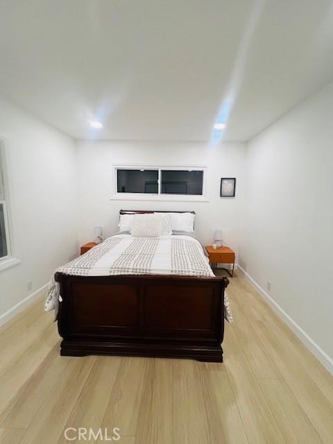 bedroom with light wood-type flooring