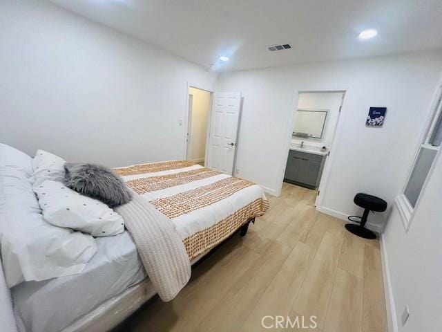 bedroom featuring light hardwood / wood-style flooring