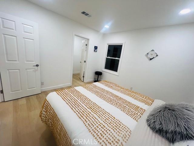 bedroom featuring light hardwood / wood-style floors