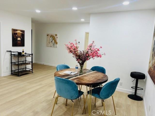 dining space featuring light hardwood / wood-style flooring