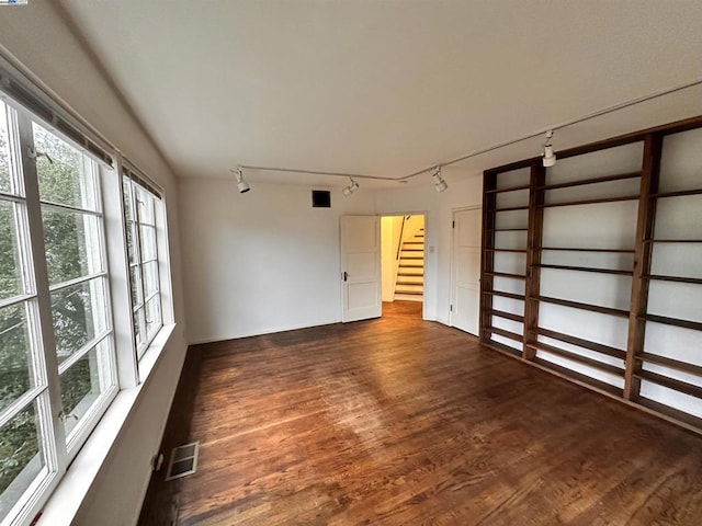 spare room with dark hardwood / wood-style flooring