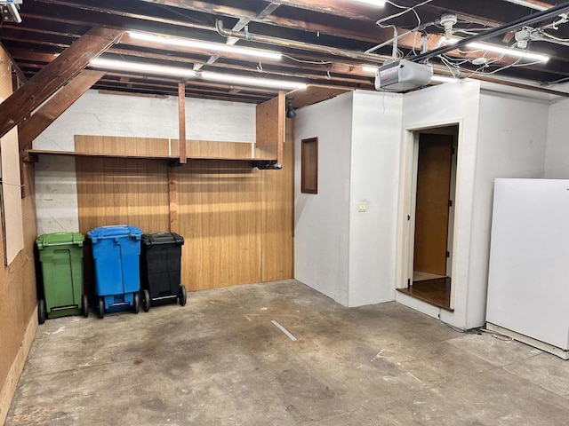 basement with white refrigerator