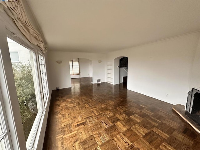 spare room with dark parquet flooring