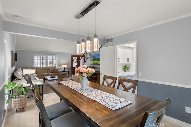 dining room with crown molding