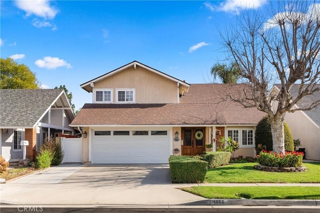 view of front facade featuring a garage and a front lawn