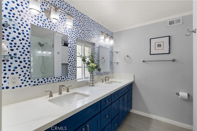 bathroom featuring an enclosed shower, vanity, and crown molding