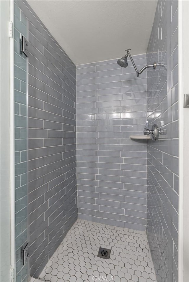 bathroom featuring an enclosed shower