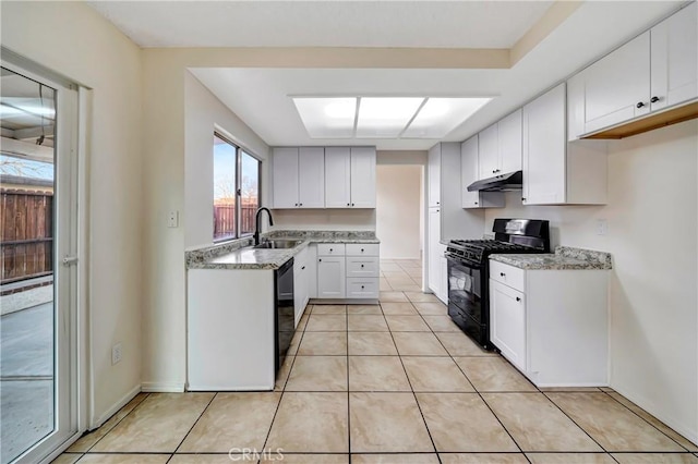 kitchen featuring sink, black appliances, white cabinets, and light tile patterned flooring