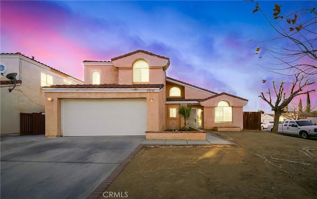 mediterranean / spanish-style house featuring a garage