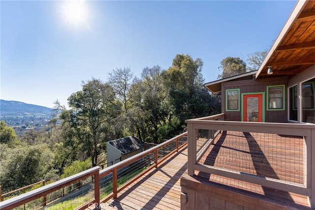 wooden terrace featuring a mountain view