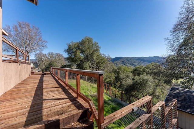 wooden deck featuring a mountain view