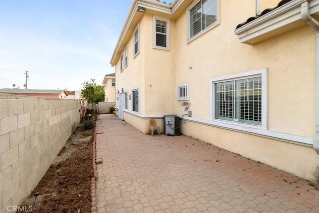 view of side of property featuring a patio