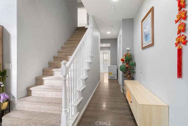 stairway featuring hardwood / wood-style floors