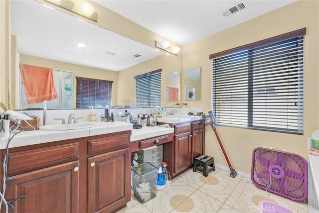 bathroom with vanity and tile patterned flooring