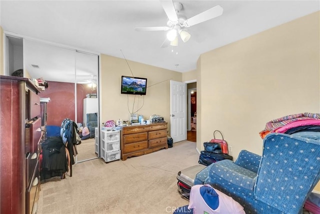 sitting room with light carpet and ceiling fan