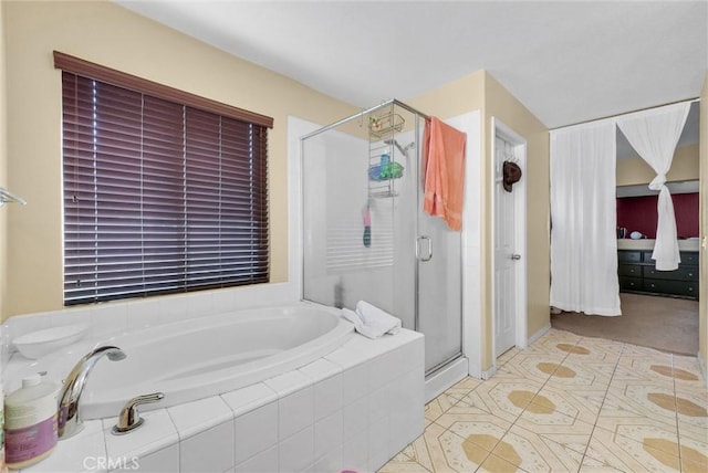 bathroom featuring tile patterned floors and plus walk in shower