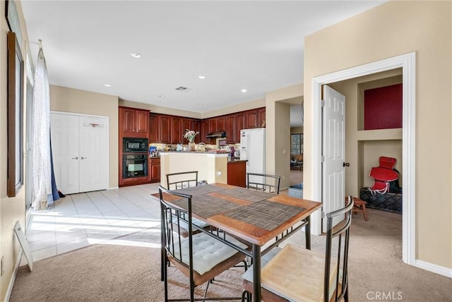 view of carpeted dining space