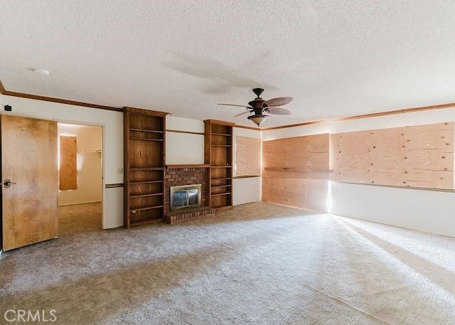 153 Calle Redondel, San Clemente, CA 92672 - unfurnished living room with ornamental molding, a ceiling fan, carpet floors, a textured ceiling, and a fireplace