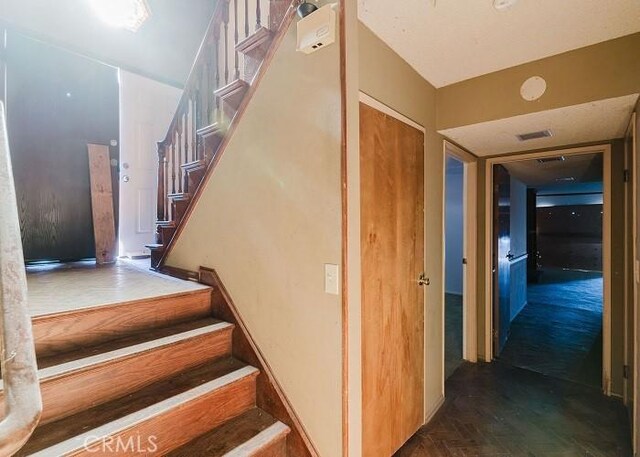 stairs with parquet flooring