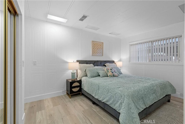 bedroom with light hardwood / wood-style floors