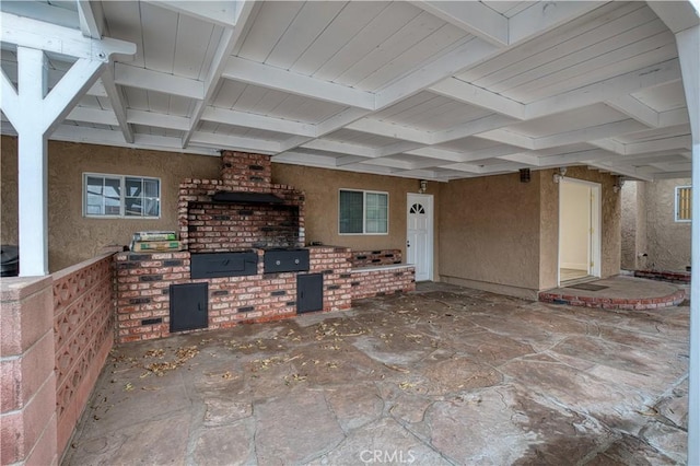 unfurnished living room with beamed ceiling