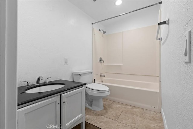 full bathroom with toilet, tile patterned floors, vanity, and shower / washtub combination