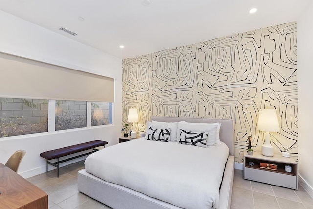 bedroom with light tile patterned floors