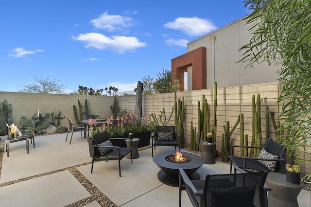 view of patio featuring an outdoor fire pit