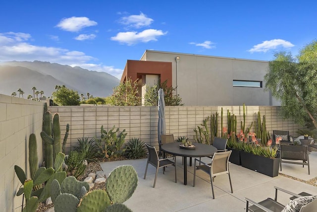 view of patio with a mountain view