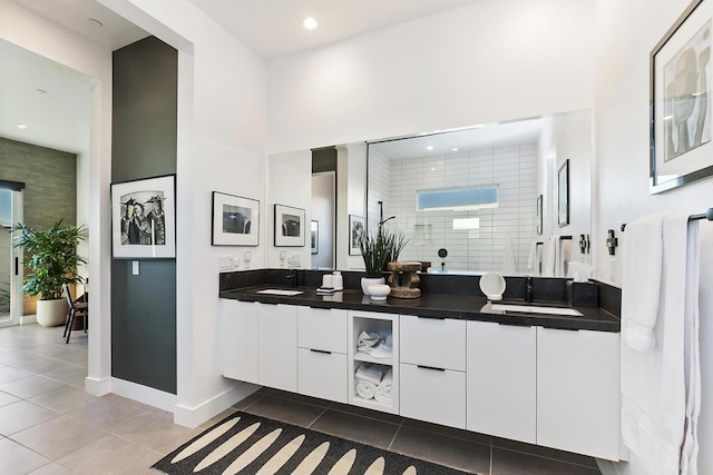 bathroom with vanity, tile patterned floors, and walk in shower