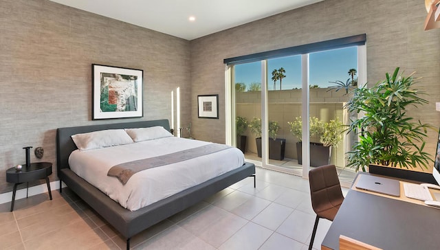 bedroom featuring access to exterior and tile patterned floors