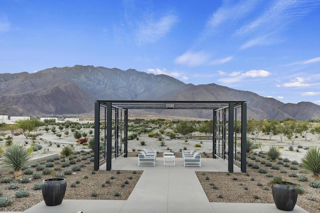 exterior space featuring a patio and a mountain view