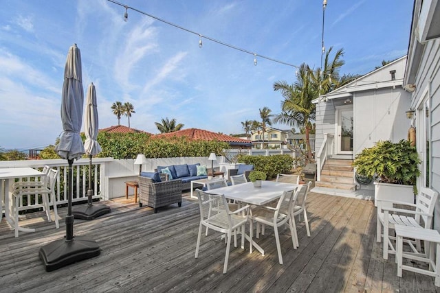 wooden terrace featuring an outdoor hangout area