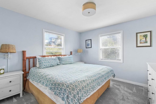 bedroom featuring carpet flooring and multiple windows