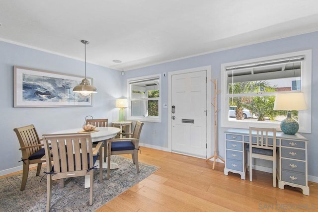 dining space with hardwood / wood-style flooring