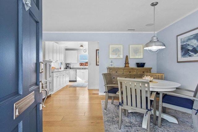 dining area with light hardwood / wood-style floors