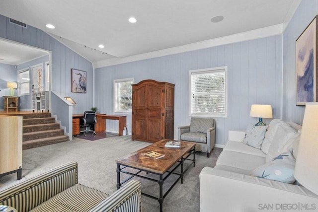 carpeted living room featuring vaulted ceiling