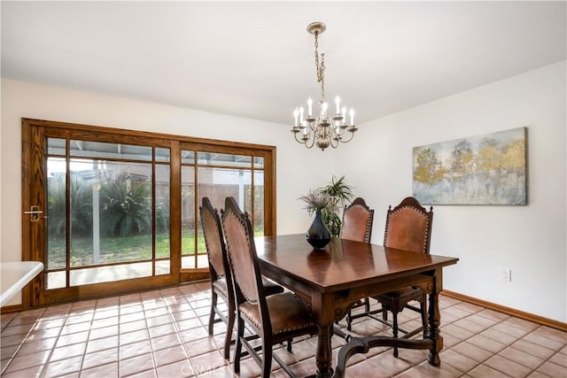 tiled dining room featuring a notable chandelier