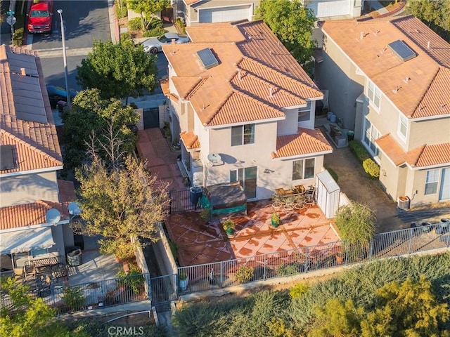 birds eye view of property with a residential view