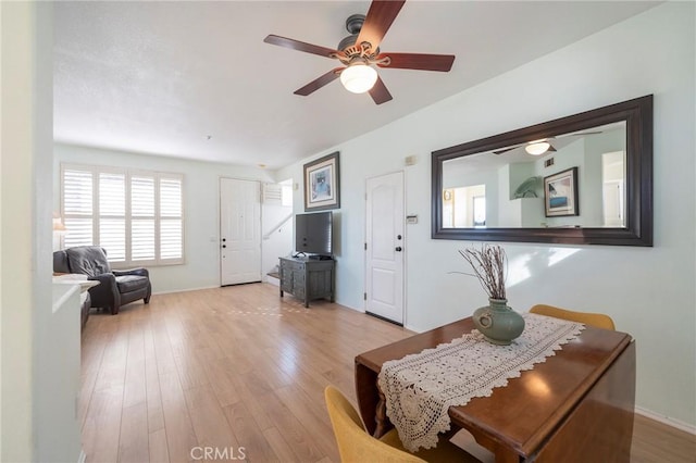 interior space featuring light wood-style floors and a ceiling fan