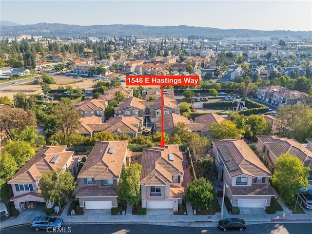 drone / aerial view with a residential view and a mountain view