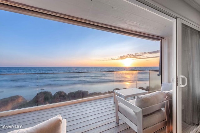 balcony at dusk with a water view