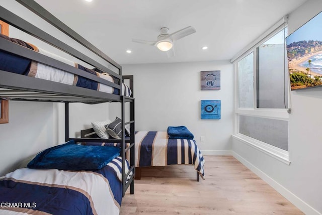 bedroom featuring light hardwood / wood-style flooring and ceiling fan