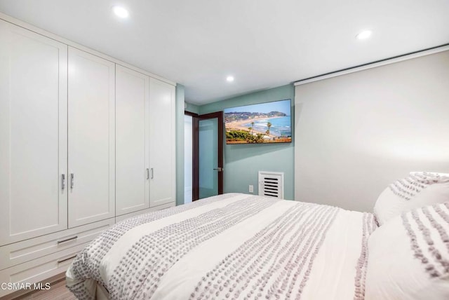 bedroom featuring hardwood / wood-style floors