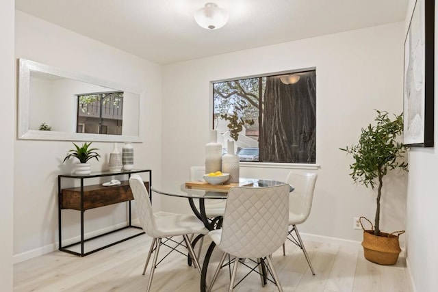 dining area featuring light wood-type flooring