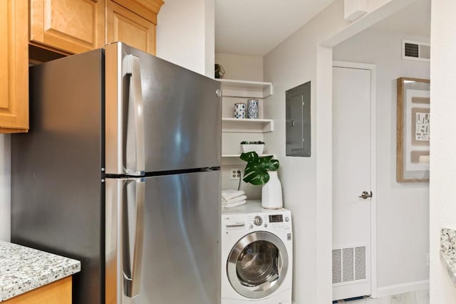 laundry area with washer / clothes dryer and electric panel