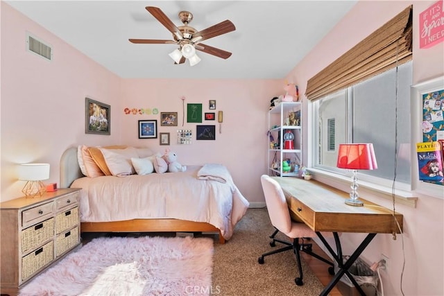 bedroom featuring light carpet and ceiling fan