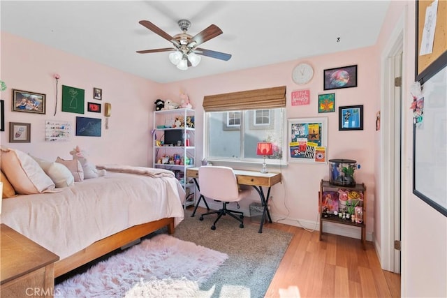 bedroom featuring ceiling fan and light hardwood / wood-style floors